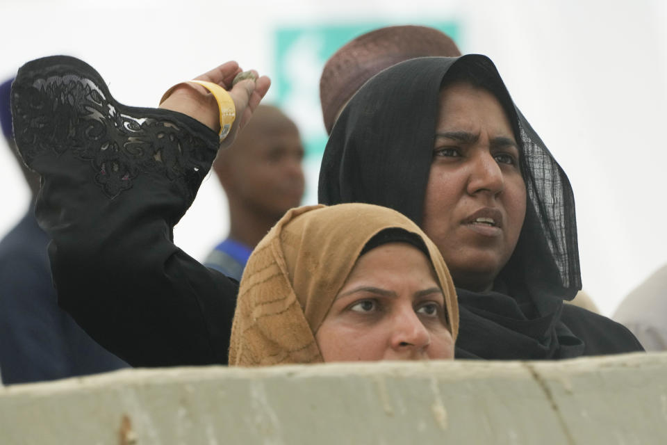 Pilgrims cast stones at a pillar in the symbolic stoning of the devil, the last rite of the annual Hajj pilgrimage, in Mina near the holly city of Mecca, Saudi Arabia, Thursday, June 29, 2023. (AP Photo/Amr Nabil)