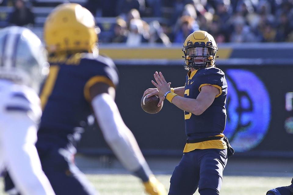 West Virginia quarterback Garrett Greene passes against Kansas State during game in Morgantown, W.Va., Saturday, Nov. 19, 2022. Greene is battling for the starting QB job heading into 2023 season. | Kathleen Batten, Associated Press