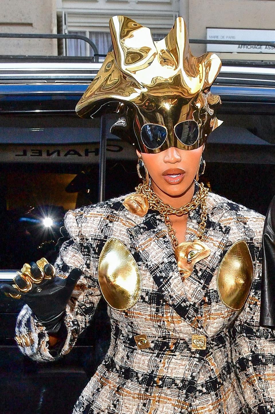 Close-up of Cardi's gold headpiece, with attached sunglasses