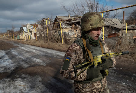 Oleg, a Lieutenant-Colonel who did not give his last name, is seen at the front line in the village of Zaitseve, Ukraine February 23, 2019. For some of the soldiers on the front line, peace is not enough. Oleg said the heavy toll of killed and wounded, both military and civilian meant there was only one option: "Only victory will do". REUTERS/Gleb Garanich