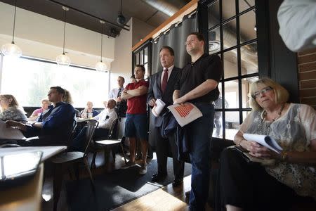 Attendees listen to a presentation during an organizing meeting for American for Prosperity in a restaurant in Anchorage, Alaska June 24, 2015. Americans for Prosperity, the Koch Brothers' political spending group, is hailed in Republican circles as one of the most effective grassroots political organizations in the country. REUTERS/Mark Meyer