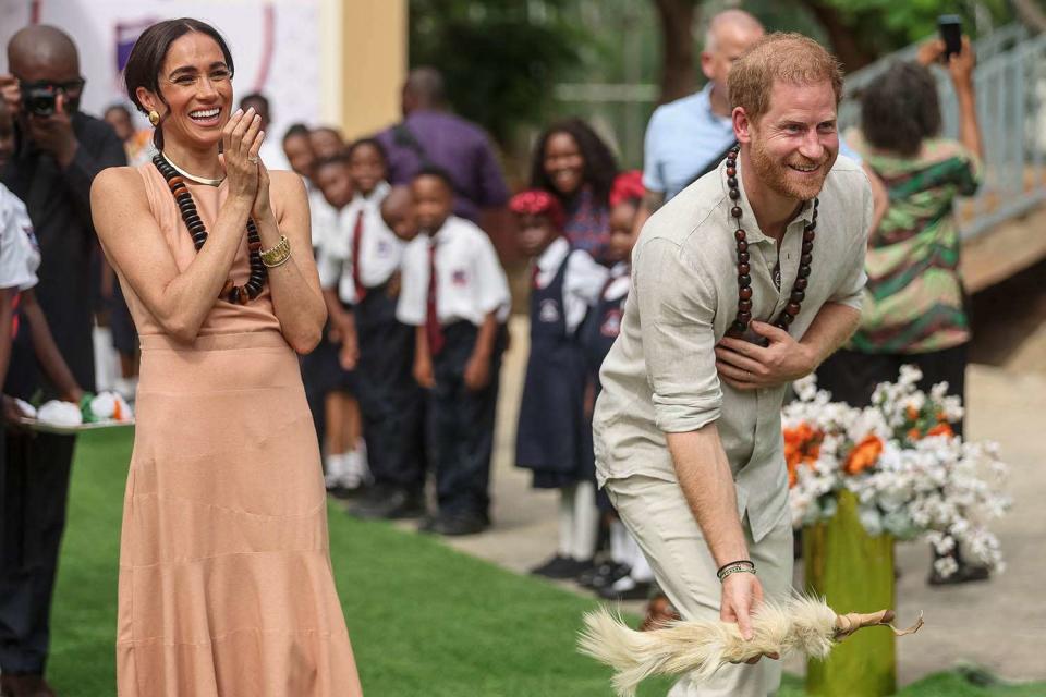 <p>KOLA SULAIMON/AFP via Getty</p> Meghan Markle and Prince Harry in Abuja on May 10, 2024