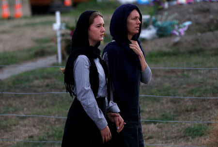 Relatives and other people arrive to attend the burial ceremony of the victims of the mosque attacks, at the Memorial Park Cemetery in Christchurch, New Zealand March 21, 2019. REUTERS/Jorge Silva