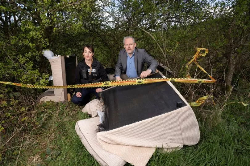 Cllr Mark Wilkes, Durham County Council’s Cabinet member for neighbourhoods and climate change, is pictured with neighbourhood warden Claire Liddle at a fly-tip in the Esh area