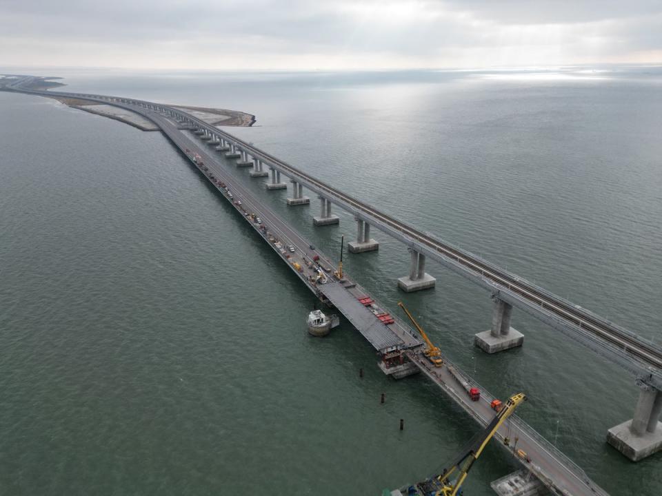 This aerial picture taken on November 8 shows repair work on damaged parts of the Kerch Bridge (Russian federal road agency Rosa)