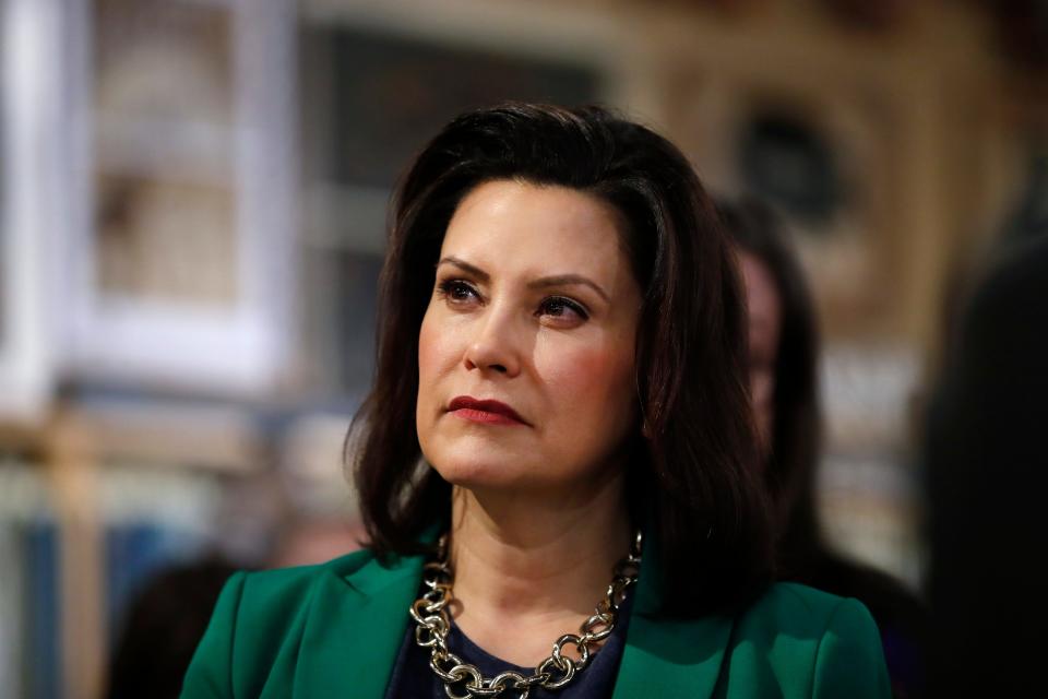 In this March 18, 2019, file photo, Michigan Gov. Gretchen Whitmer listens to Democratic presidential candidate Sen. Kirsten Gillibrand, D-N.Y., in Clawson, Mich.