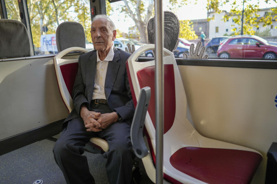 Emanuele Di Porto, 92, sits on aboard a bus of the No. 23 route during the inaugurating of a traveling exhibit recounting his story, in Rome, Tuesday, Oct. 10, 2023. Di Porto, at the time a 12 years old Roman Jew, hid on a tram for a few days from Nazi deportation in October 1943, with drivers feeding him and helping him.The traveling exhibit is a highlight of events commemorating the 80th anniversary of the roundup of some 1,200 of the city's tiny Jewish community by German soldiers during the Nazi occupation in the latter years of World War II. (AP Photo/Andrew Medichini)