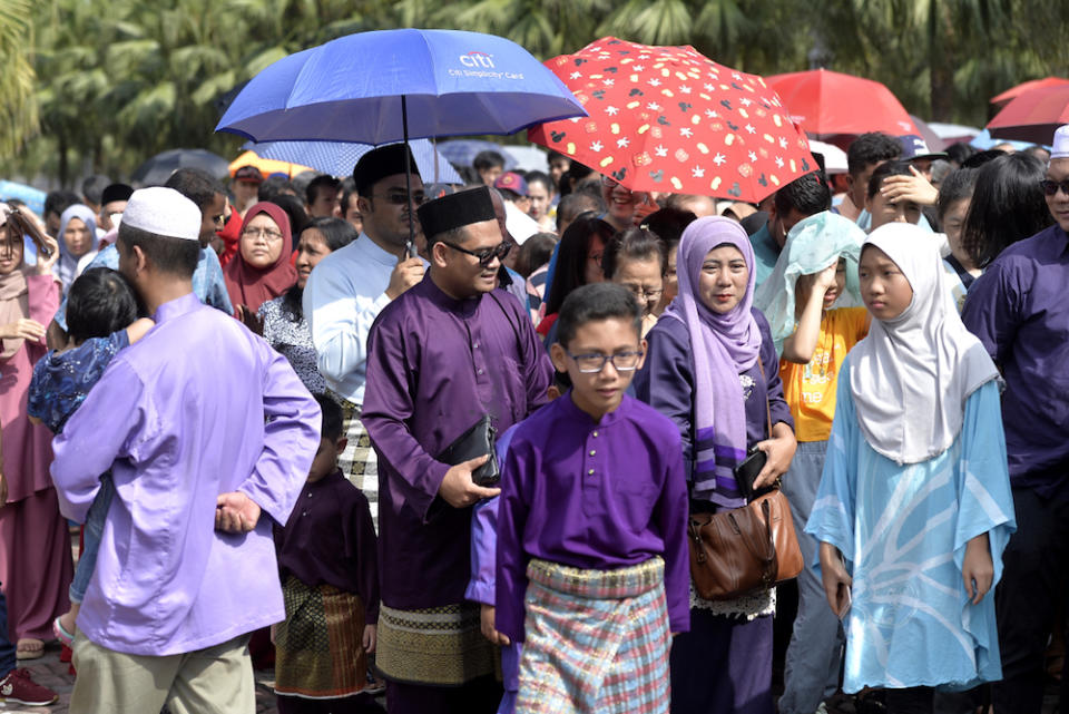 People arrive for the Prime Minister’s Raya Open House at Seri Perdana in Putrajaya June 5, 2019. — Picture by Miera Zulyana