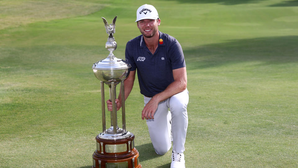 Sam Burns photographed with the trophy after his win in the 2022 Charles Schwab Challenge