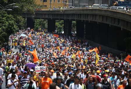 Opposition supporters protest against Venezuela's President Nicolas Maduro's government during a rally in Caracas, Venezuela April 1, 2017. REUTERS/Carlos Garcia Rawlins