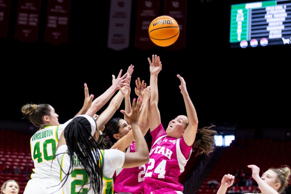Utah Utes guard Kennady McQueen (24) and guard Inês Vieira (2) jump to grab the rebound against Oregon Ducks forward Grace VanSlooten (40) and guard Chance Gray (2) during a game at the Huntsman Center in Salt Lake City on Saturday, Feb. 11, 2023. | Marielle Scott, Deseret News