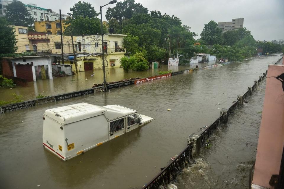 <div class="paragraphs"><p>A partially submerged vehicle due to waterlogging following heavy rains in Lucknow on Thursday, 16 September.</p></div>