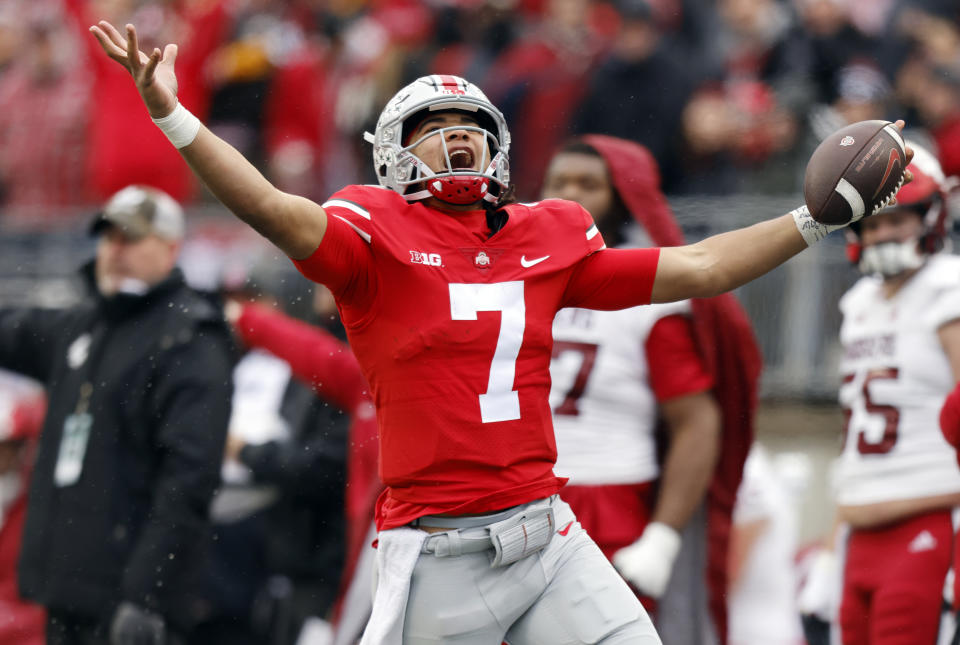 FILE - Ohio State quarterback C.J. Stroud celebrates after a long run against Indiana during the second half of an NCAA college football game Saturday, Nov. 12, 2022 in Columbus, Ohio. Ohio State won 56-14. Stroud was named AP All-Big Ten Offensive player of the year, Wednesday, Dec. 7, 2022. (AP Photo/Paul Vernon, File)