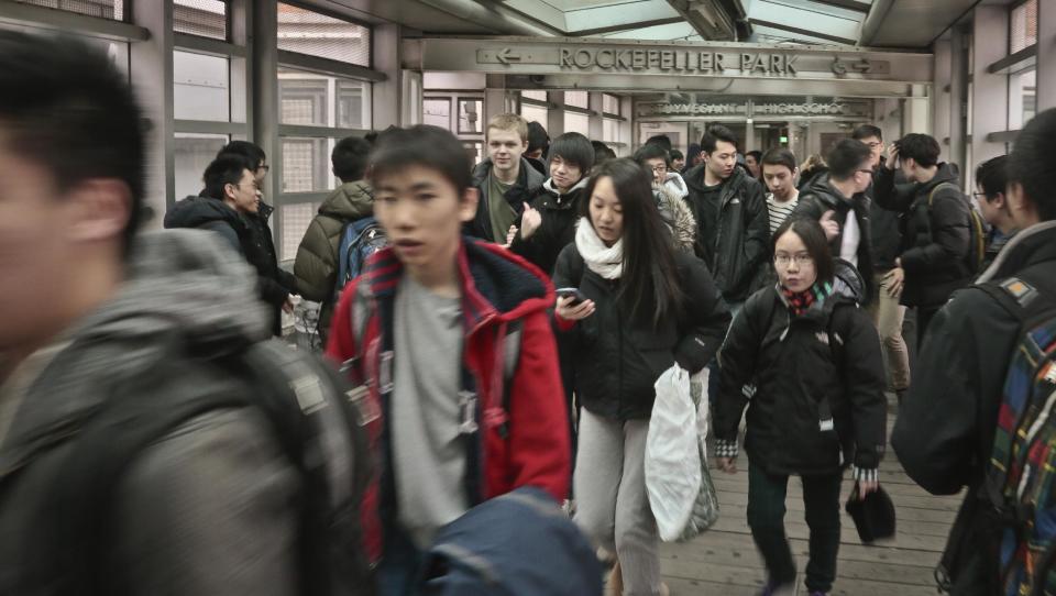 In this March 25, 2014 photo, students leave Stuyvesant High School, one of the nine specialized public high schools in New York City. New York state has the most segregated public schools in the nation, according to a report released Wednesday by the Civil Rights Project at the University of California at Los Angeles. (AP Photo/Bebeto Matthews)