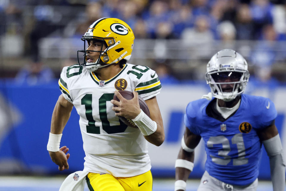 Green Bay Packers quarterback Jordan Love scrambles during the second half of an NFL football game against the Detroit Lions, Thursday, Nov. 23, 2023, in Detroit. (AP Photo/Duane Burleson)