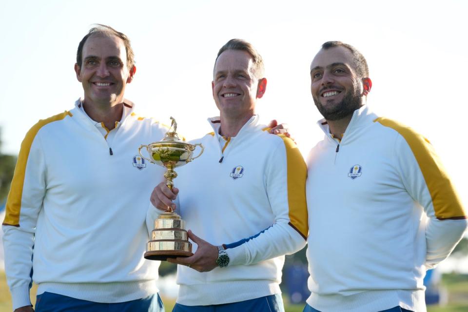 Edoardo Molinari, left, with captain Donald and fellow vice-captain Francesco Molinari (AP)