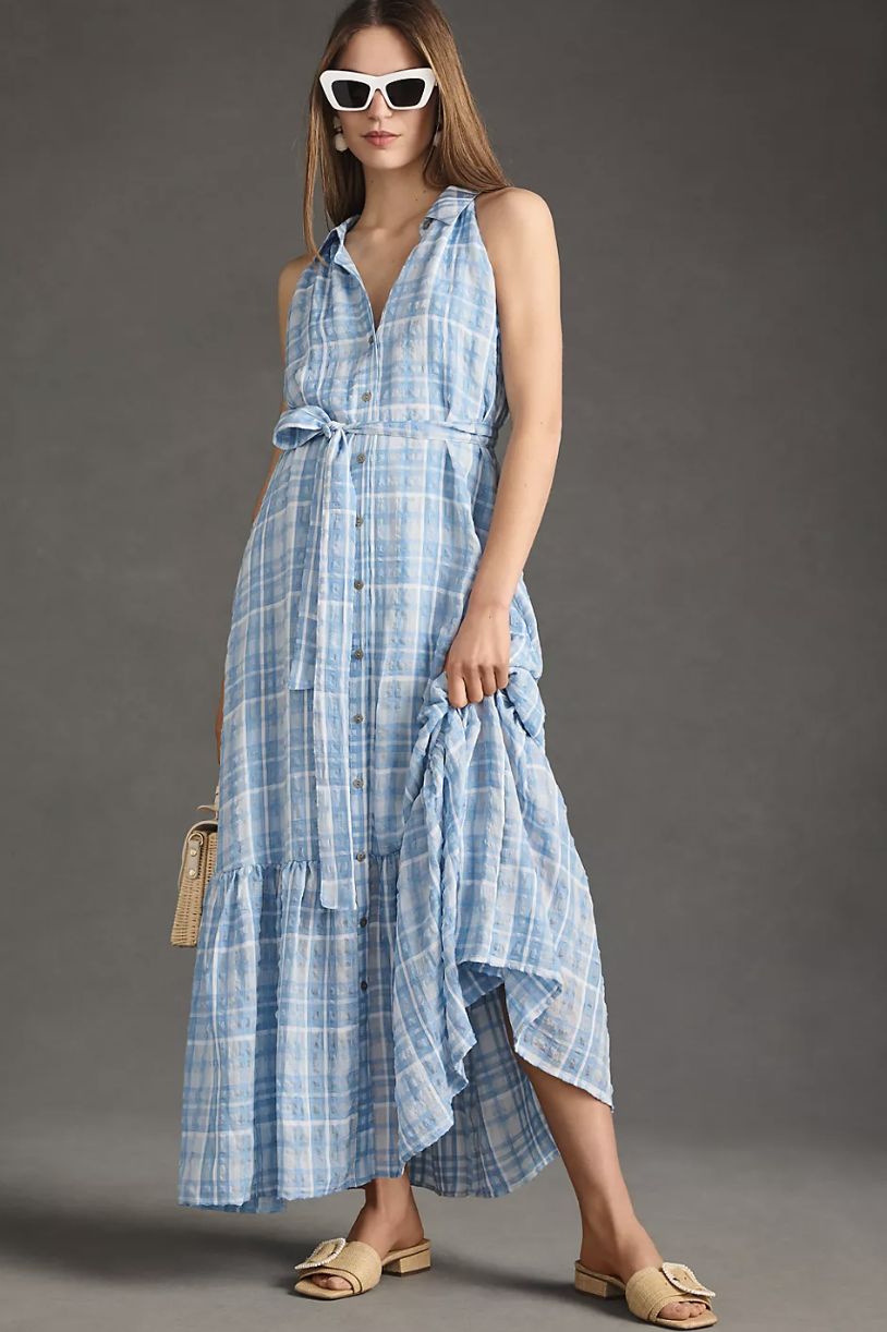 model wearing white sunglasses and blue By Anthropologie Sleeveless Buttondown Shirt Dress (photo via Anthropologie)
