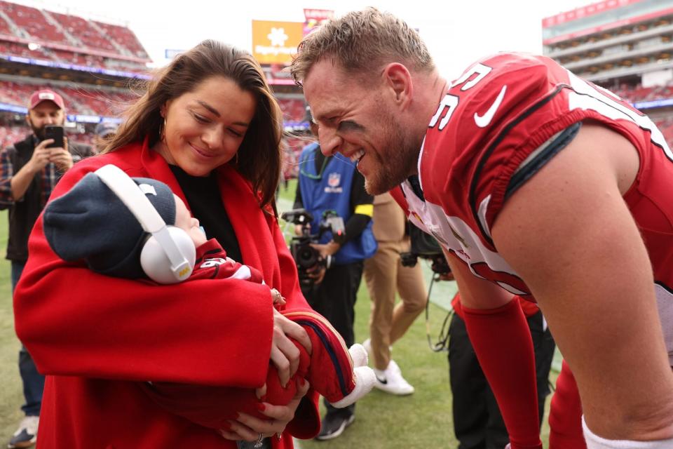 SANTA CLARA, CALIFORNIA - JANUARY 08: J.J. Watt #99 of the Arizona Cardinals talks with his wife Kealia Watt and son Koa Watt prior to the game against the San Francisco 49ers at Levi's Stadium on January 08, 2023 in Santa Clara, California. (Photo by Ezra Shaw/Getty Images)