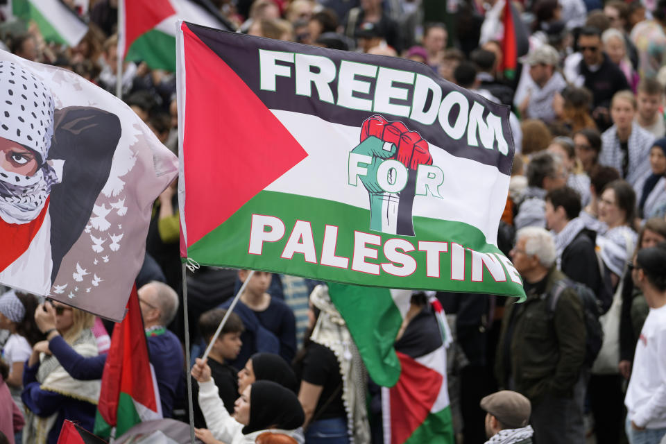 People wave flags during a Pro-Palestinian demonstration for excluding Israel from Eurovision ahead of the second semi-final at the Eurovision Song Contest in Malmo, Sweden, Thursday, May 9, 2024. (AP Photo/Martin Meissner)