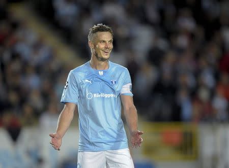 Malmo's Markus Rosenberg reacts after scoring in the Champions League playoff second leg soccer match against Salzburg in Malmo August 27, 2014. REUTERS/Bjorn Lindgren/TT News Agency