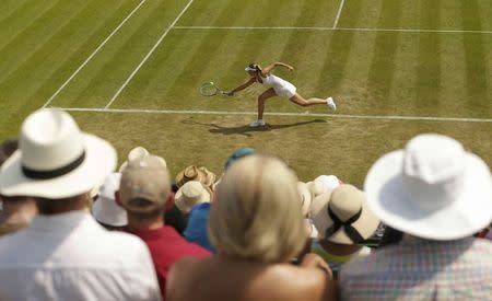 Maria Sharapova of Russia hits a shot during her match against Richel Hogenkamp of the Netherlands at the Wimbledon Tennis Championships in London, July 1, 2015. REUTERS/Henry Browne