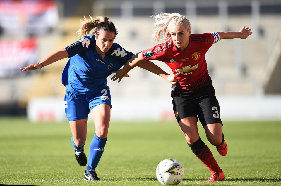 Alex Greenwood of Manchester United Women and Charley Boswell of Lewes Women 