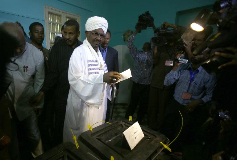 Sudan's President Omar al-Bashir casts his vote in the presidential elections at a polling station in the St Francis school in the capital Khartoum, on April 13, 2015