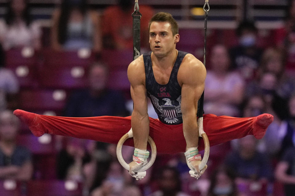 Sam Mikulak competes on the still rings during the men's U.S. Olympic Gymnastics Trials Saturday, June 26, 2021, in St. Louis. (AP Photo/Jeff Roberson)