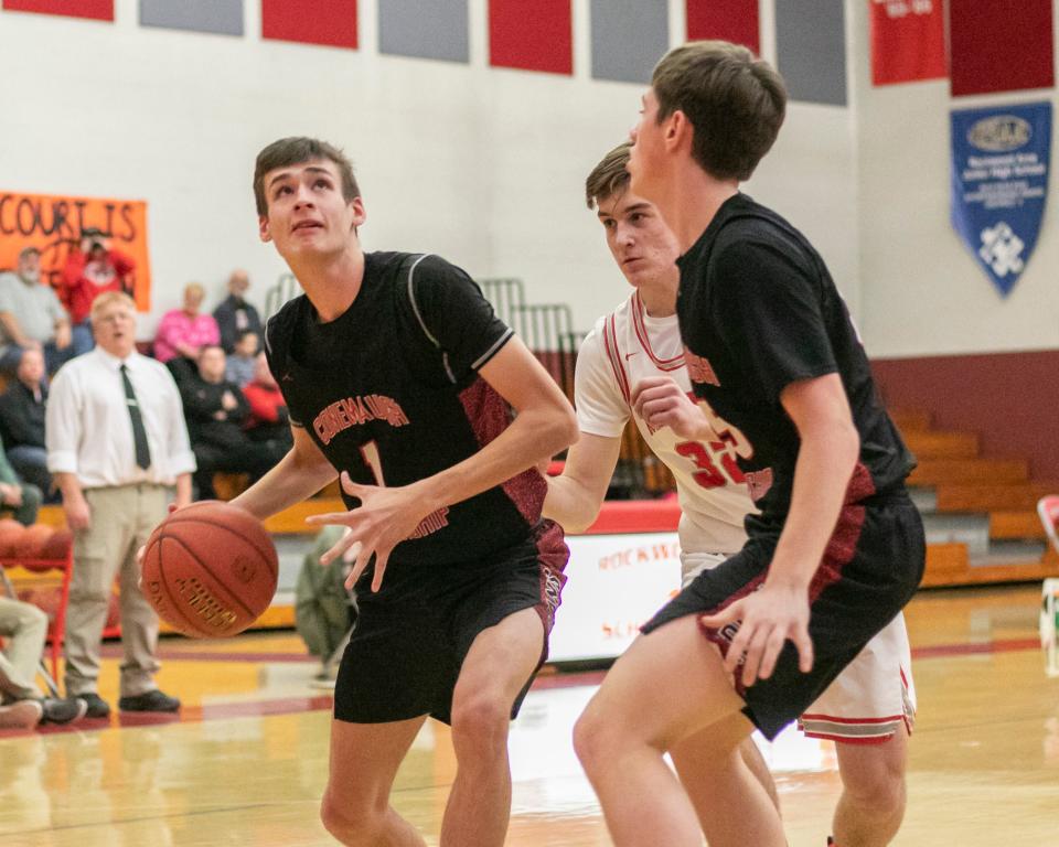 Conemaugh Township's Alex Gregory readies to go up for a layup in front of Rockwood's Zeke Foy during a WestPAC boys basketball semifinal, Feb. 15, in Rockwood.