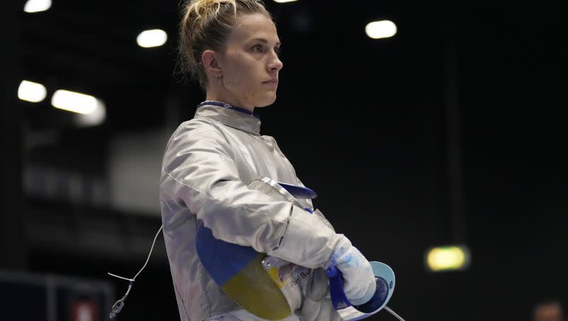 Ukraine’s Olga Kharlan stands during the women’s Team Sabre against Uzbekistan, at the Fencing World Championships in Milan, Italy, Saturday, July 29, 2023.