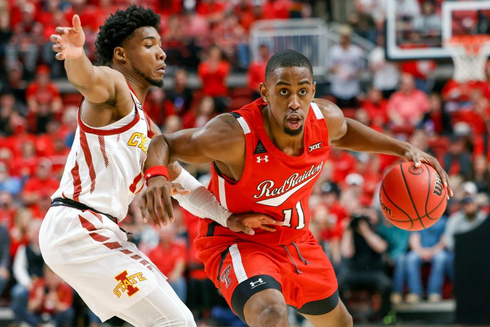 Texas Tech's Bryson Williams (11) attempts to dribble around Iowa State's Tyrese Hunter (11) during the first half of a Big 12 Conference game Tuesday against No. 15 Iowa State inside United Supermarkets Arena.