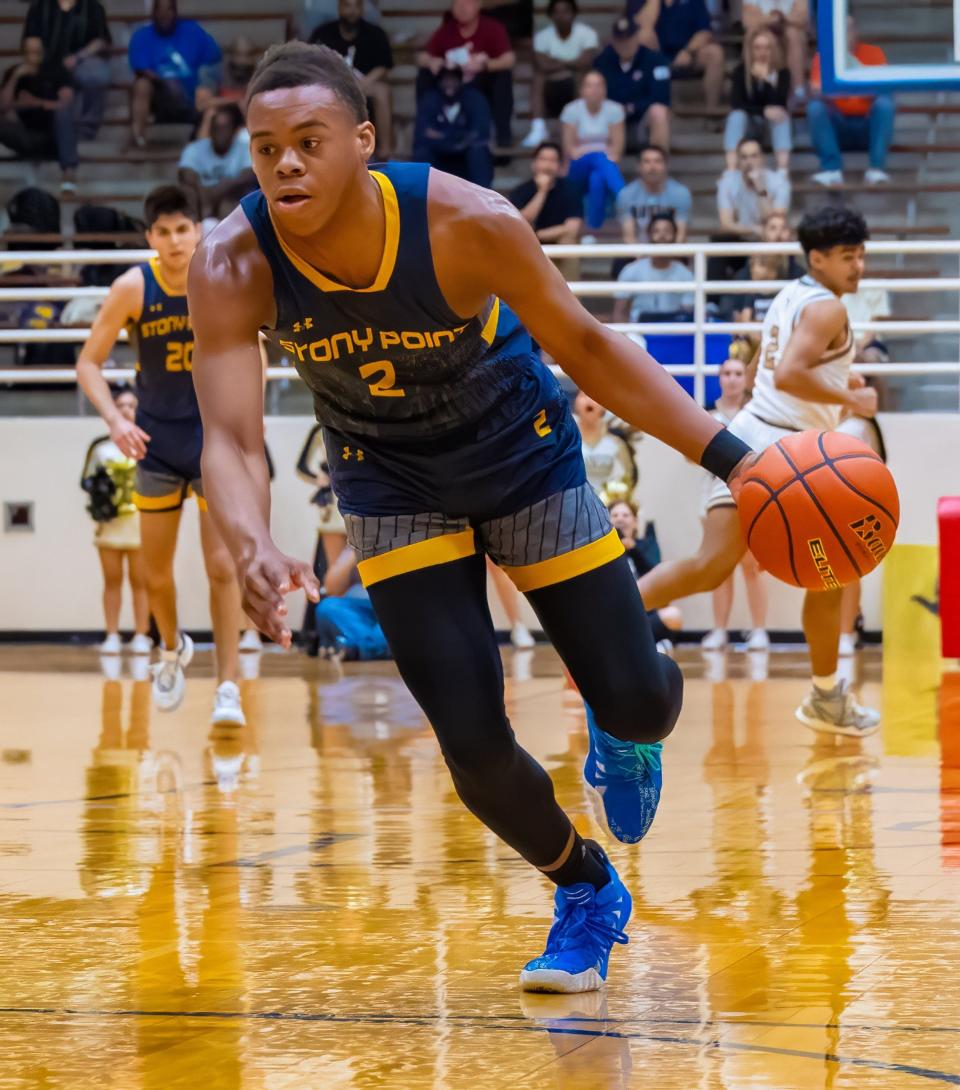 Stony Point Tigers forward Josiah Moseley drives to the paint against the Johnson Jaguars during the regional quarterfinal playoff in February at Toney Burger Athletic Center. He'll lead one of the top teams in Central Texas this season.
