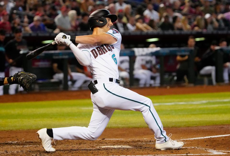 Diamondbacks designated hitter Dominic Canzone (6) swings at a pitch against the Pirates during a game at Chase Field in Phoenix on July 8, 2023.