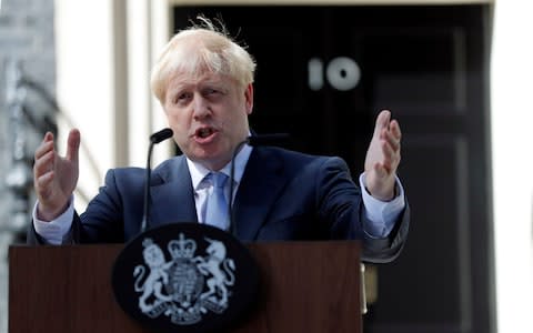 Britain's new Prime Minister Boris Johnson gestures as he speaks outside 10 Downing Street - Credit: Frank Augstein/AP