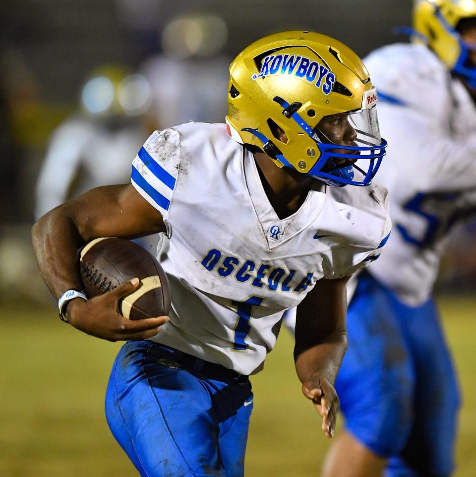 Osceola running back Taevion Swint (1) runs with the ball In a 3-4S regional quarterfinal game against Treasure Coast on Friday, Nov. 10, 2023, at South County Stadium in Port St. Lucie.