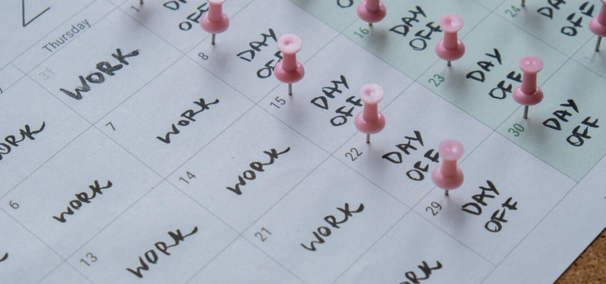 4 day work week printed calendar with pink pins on three days off in week weekend days four day working week concept. Modern approach doing business short workweek. Effectiveness of employees. Productivity and efficiency days off