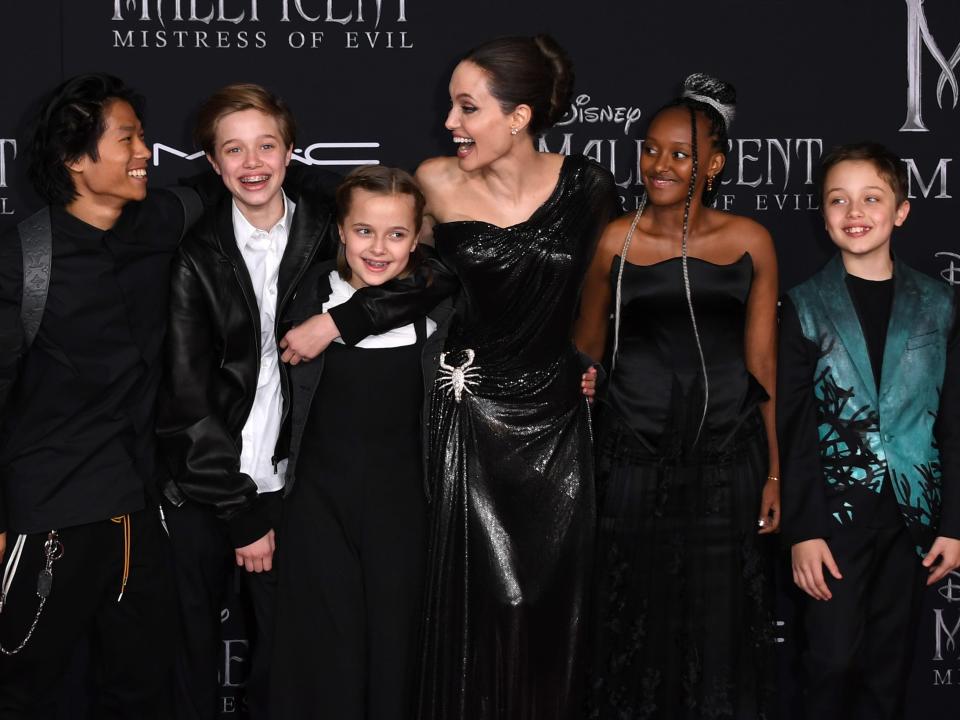 angelina jolie with kids on the red carpet at maleficant premiere