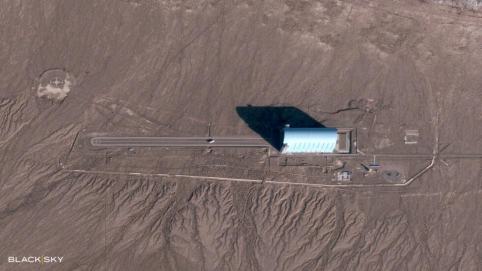 A satellite image taken on November 4, 2022, showing what looks to be a teardrop-shaped airship or aerostat in front of the hangar. This was before the completion of the extension, but the foundation is visible. <em>BlackSky</em> <em>BlackSky</em>