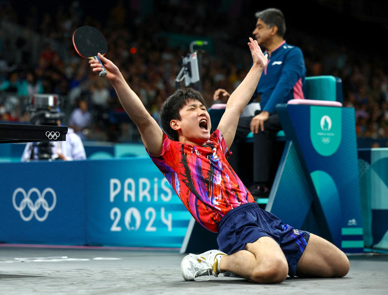 Tomokazu Harimoto of Japan celebrates as he wins his Men's Singles Round of 32 match against Noshad Alamiyan of Iran on July 31, 2024. (Kim Hong-Ji/Reuters)