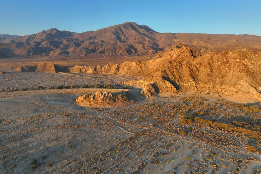 La Quinta, California-Sept. 14, 2022-A large wave pool / surf park is planned for Coral Mountain in La Quinta, California. Local residents are concerned about the development. Coral Mountain (right front) is lite by the morning sun on Sept. 14, 2022. (Carolyn Cole / Los Angeles Times)