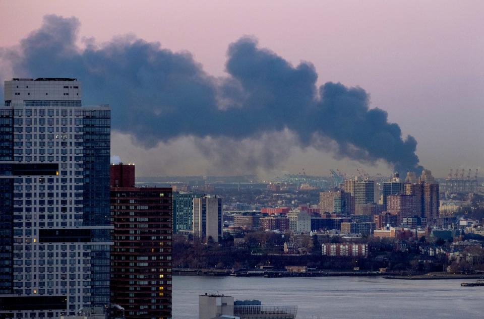 Smoke rises south of the New York borough of Manhattan as a warehouse burns in Elizabeth, N.J., spreading smoke over the southern skyline of New York Friday, Jan. 5, 2024. (AP Photo/Craig Ruttle) ORG XMIT: NYCR102