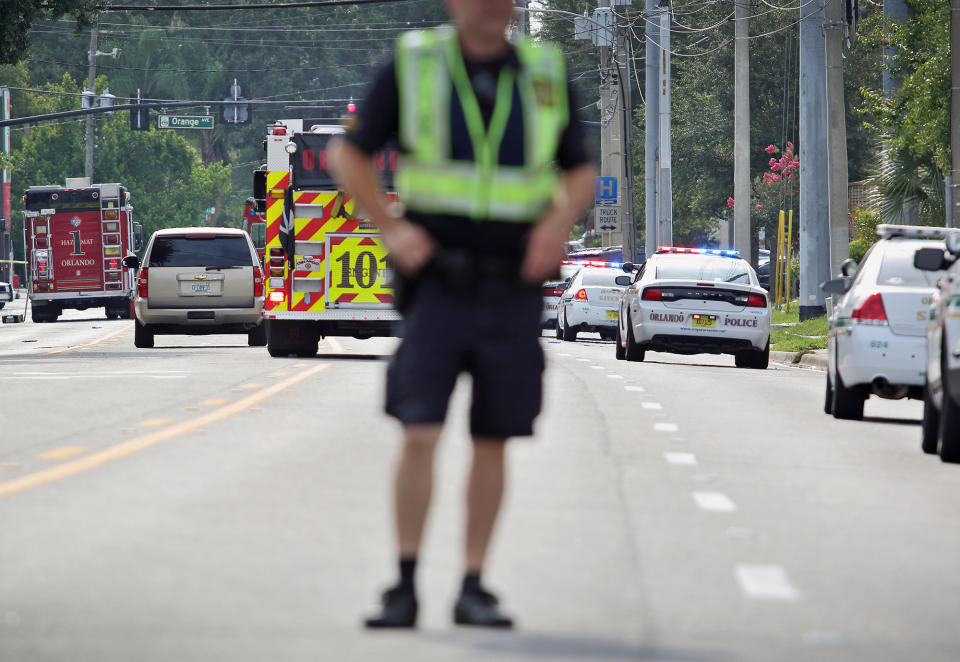 <p>Police and rescue officers monitor the scene of a shooting at Pulse nightclub in Orlando, June 12, 2016. (EPA/CRISTOBAL HERRERA) </p>