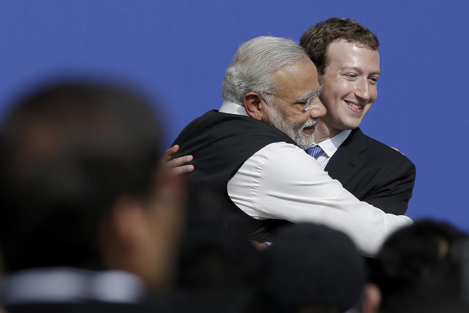 FILE - In this Sept. 27, 2015, file photo, Facebook CEO Mark Zuckerberg, right, hugs Prime Minister of India Narendra Modi at Facebook in Menlo Park, Calif.. Facebook in India has been selective in curbing hate speech, misinformation and inflammatory posts, particularly anti-Muslim content, according to leaked documents obtained by The Associated Press, even as the internet giant's own employees cast doubt over the motivations and interests. (AP Photo/Jeff Chiu, File)