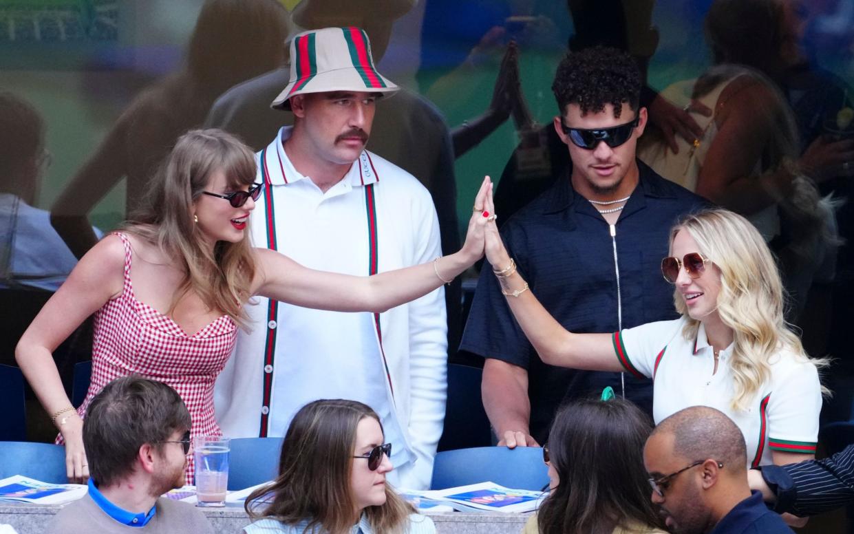 Taylor Swift and Brittany Mahomes at the US Open on Sunday, with their partners Travis Kelce and Patrick Mahomes looking on