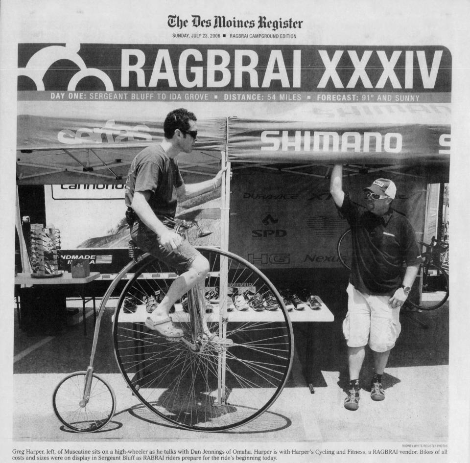 Greg Harper, left, of Muscatine, sits on a penny-farthing bicycle as he talks with Dan Jennings of Omaha, Nebraska, on July 22, 2006 in Sergeant Bluff before the start of RAGBRAI XXXIV. The route on the first day of RAGBRAI XLIX in 2022 will go through the same pass-through towns.