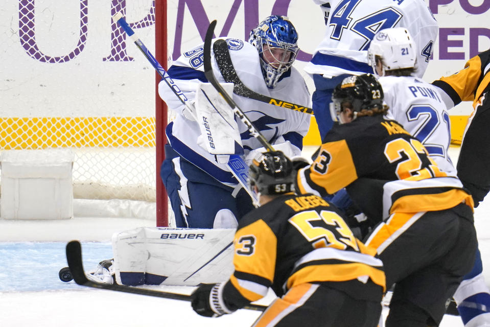 Tampa Bay Lightning goaltender Andrei Vasilevskiy (88) blocks a shot during the first period of an NHL hockey game against the Pittsburgh Penguins in Pittsburgh, Tuesday, Oct. 26, 2021. (AP Photo/Gene J. Puskar)