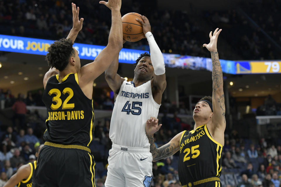 Memphis Grizzlies forward GG Jackson (45) looks to shoot between Golden State Warriors forward Trayce Jackson-Davis (32) and guard Lester Quinones (25) in the second half of an NBA basketball game Monday, Jan. 15, 2024, in Memphis, Tenn. (AP Photo/Brandon Dill)