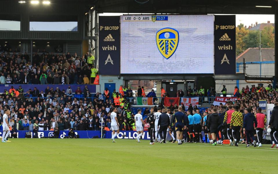 Players leave the pitch at Elland Road - Lindsey Parnaby/AFP