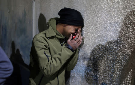 A relative of a Palestinian Hamas militant reacts at a hospital in the central Gaza Strip January 22, 2019. REUTERS/Ibraheem Abu Mustafa