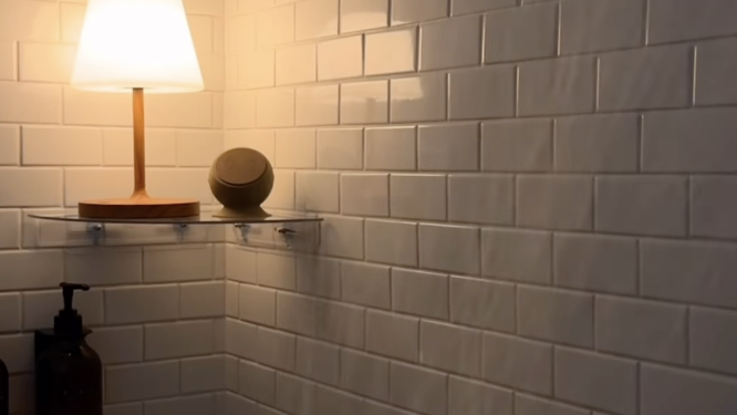 a brick wall with a lamp and a lamp on it